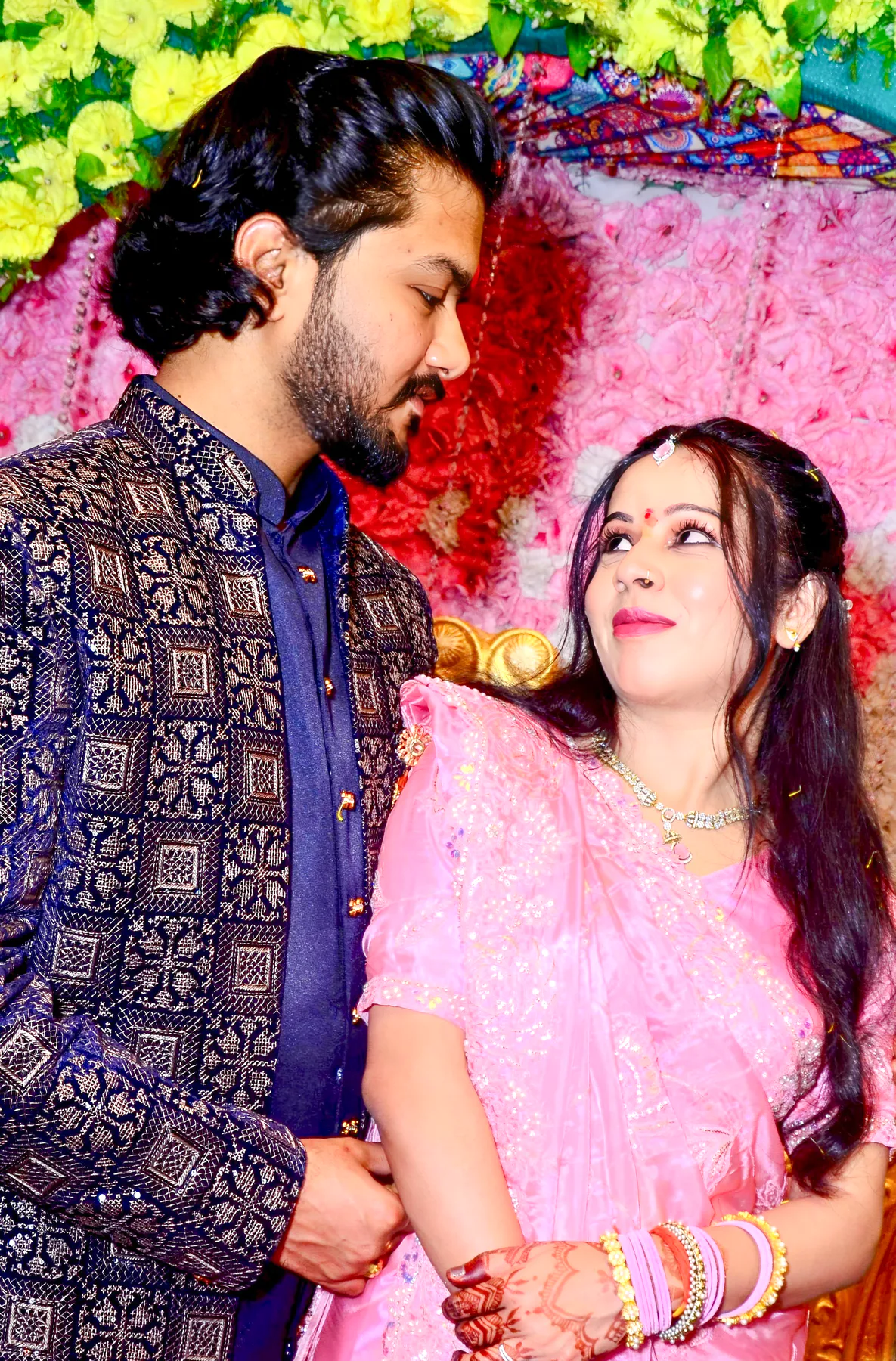 Pooja and Yuvaraj dressed for a festive ceremony